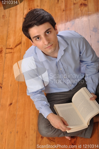 Image of Man reading a book