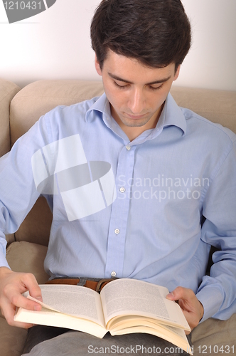 Image of Man reading a book