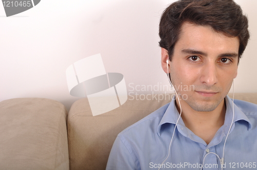 Image of Man listening to music