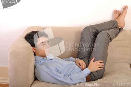 Image of Man sleeping on the couch