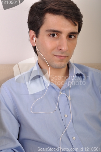 Image of Man listening to music
