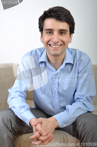 Image of Man sitting on the couch