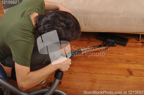 Image of Man doing the housework