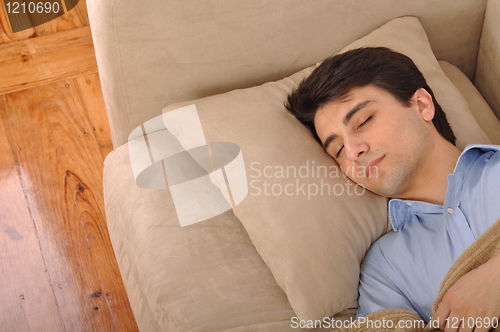Image of Man sleeping on the couch