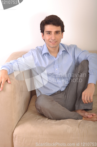 Image of Man sitting on the couch