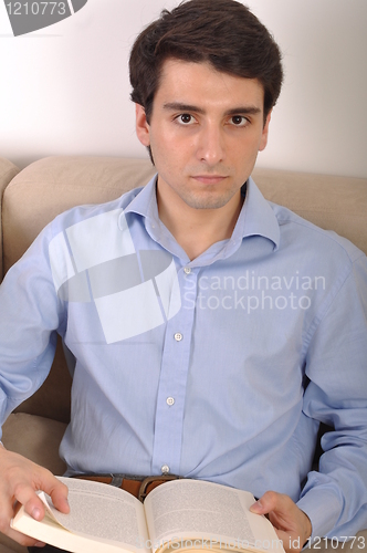Image of Man reading a book