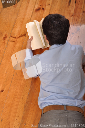 Image of Man reading a book