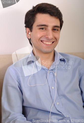 Image of Man listening to music