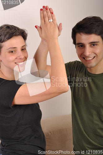 Image of Sister and brother high five