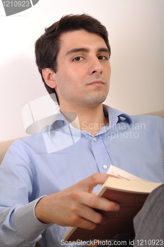 Image of Man reading a book