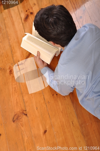 Image of Man reading a book