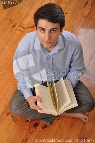 Image of Man reading a book