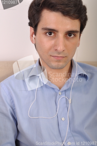 Image of Man listening to music