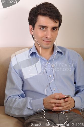 Image of Man listening to music