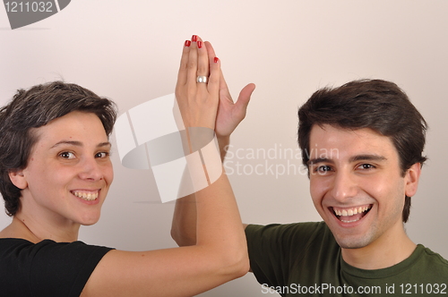 Image of Sister and brother high five