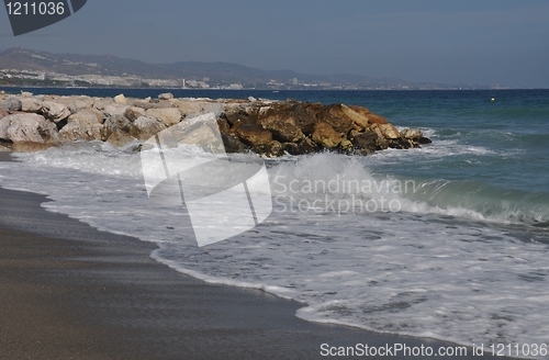 Image of Puerto Banus beach and stone pier