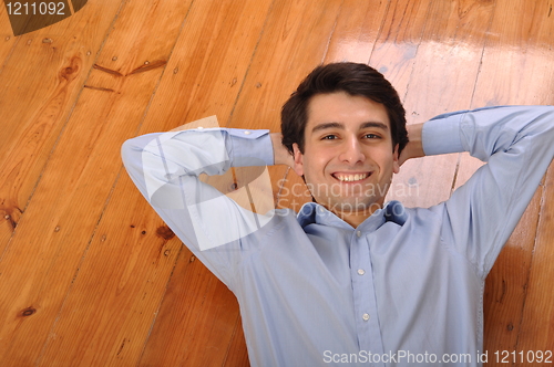 Image of Man lying on the floor