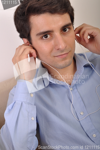 Image of Man listening to music