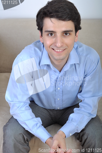 Image of Man sitting on the couch