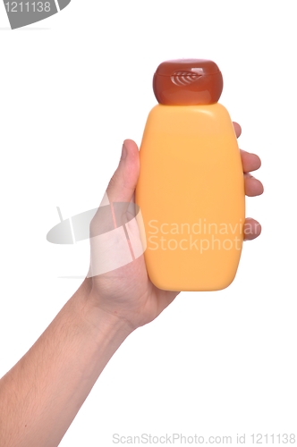 Image of Hand holding sun lotion