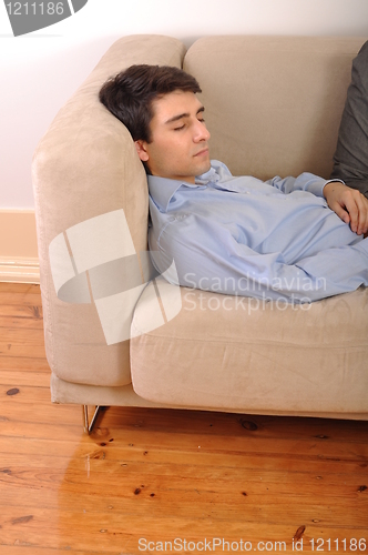 Image of Man sleeping on the couch