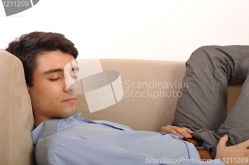 Image of Man sleeping on the couch
