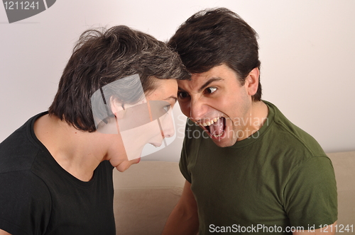 Image of Woman and man yelling face to face