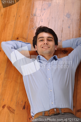 Image of Man lying on the floor