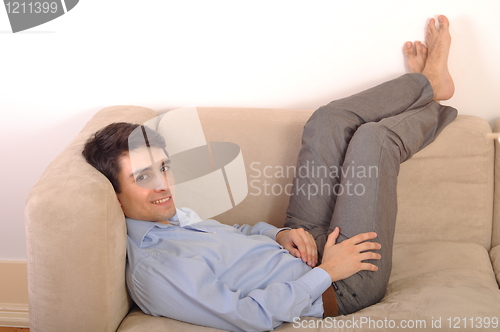 Image of Man relaxing on the couch