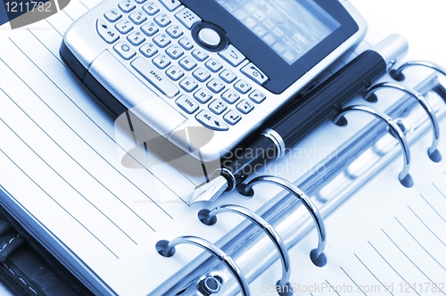 Image of note book and phone