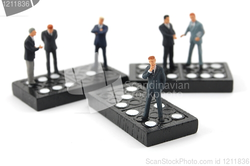 Image of business man on domino 