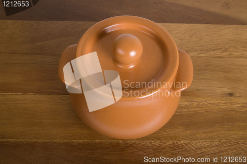 Image of Clay pot on the wooden board