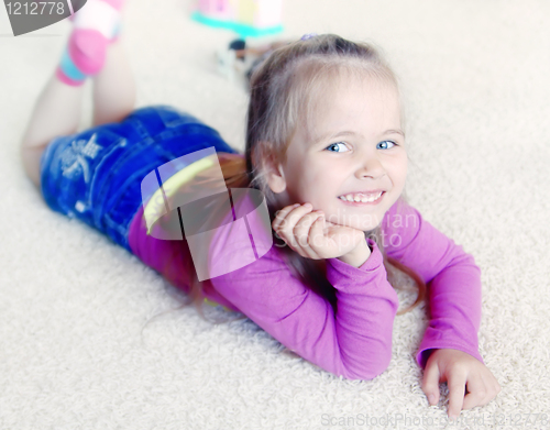 Image of Little girl on a carpet