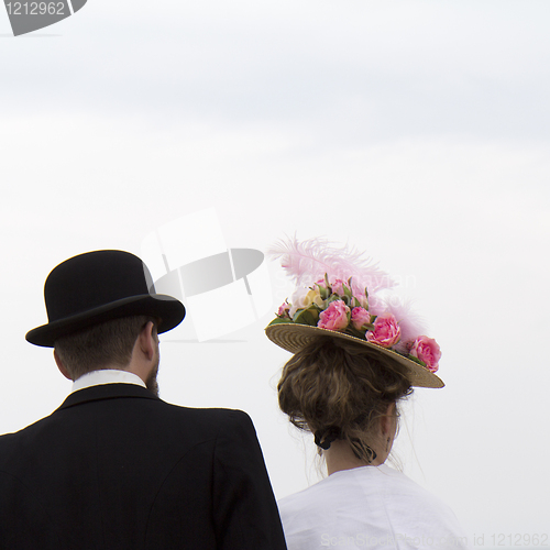 Image of Couple wearing vintage hats.