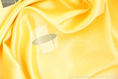 Image of Smooth elegant golden silk as background 