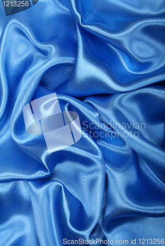 Image of Smooth elegant blue silk as background 