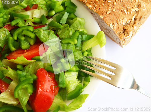Image of Healthy vegetarian Salad and bread on the white plate