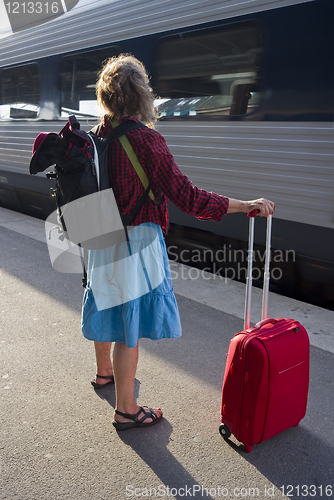 Image of Woman with roller bag
