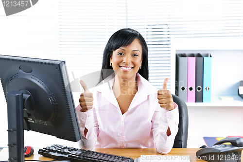 Image of Businesswoman giving thumbs up