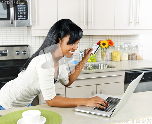 Image of Woman shopping online at home