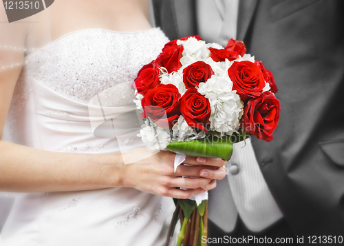 Image of Bride and groom with bridal bouquet