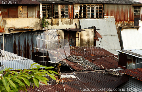 Image of old rusty metal housing at day 