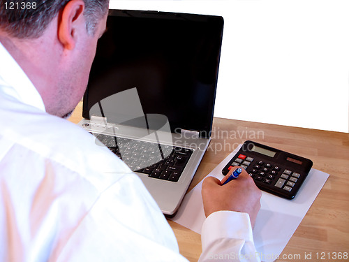 Image of businessman work on laptop