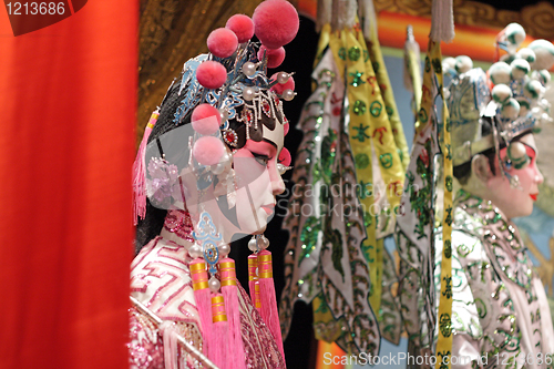 Image of chinese opera dummy and red cloth as text space ,it is a toy,not