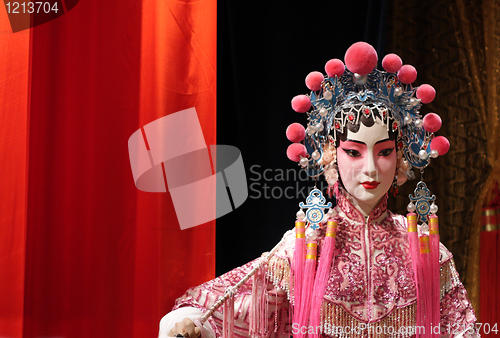 Image of chinese opera dummy and red cloth as text space ,it is a toy,not