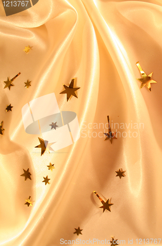 Image of New year holiday golden silk as background 