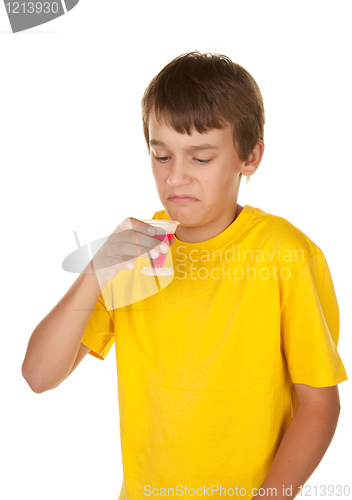 Image of boy drinking medicine