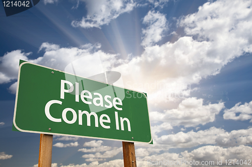 Image of Please Come In Green Road Sign Against Clouds