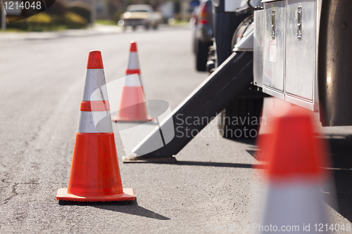 Image of Orange Hazard Safety Cones and Work Truck