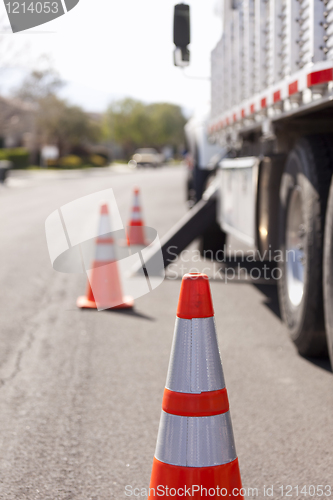 Image of Orange Hazard Safety Cones and Work Truck